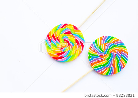 Rainbow lollipop on white background. Rainbow lollipop on white background. 98258821