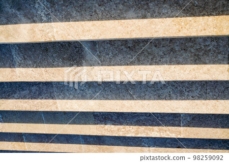 Staircase in the city, black and white pattern on the stairs on a sunny day. 98259092