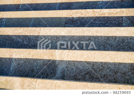 Staircase in the city, black and white pattern on the stairs on a sunny day. 98259093