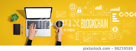 Blockchain theme with person using laptop computer 98259589