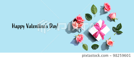 Valentines Day message with a gift box and roses Valentines Day message with a gift box and roses 98259601