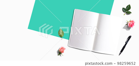 Blank open notebook with a pen from above Blank open notebook with a pen from above 98259652