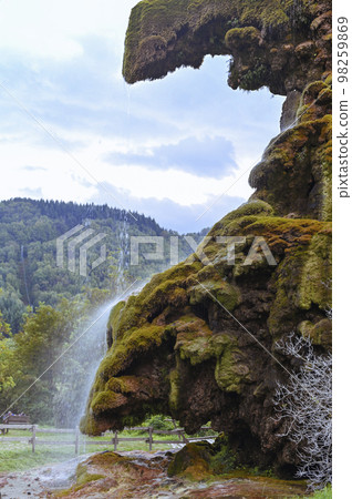 Waterfall in the mountains in italy. Autumn scenery in northern italy 98259869