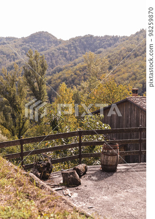 Hills of italy in autumn farm. Forest and old huts in the village. 98259870