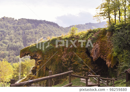 Waterfall in the mountains in italy. Autumn scenery in northern italy 98259880
