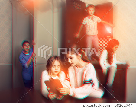 Two preteen girls solving riddles in quest room, toned image 98261744