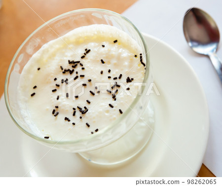 Image of tasty creamy mousse served at plate with spoon 98262065