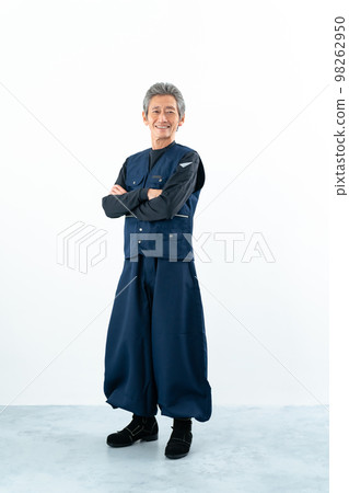 Senior craftsman with folded arms Senior craftsman with folded arms 98262950
