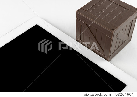 A wooden box of tablets and toys. Storage image of tablet device A wooden box of tablets and toys. Storage image of tablet device 98264604