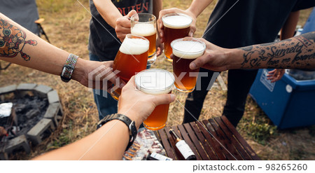 Group of friends toasting beer glasses Group of friends toasting beer glasses 98265260