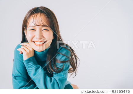 woman in blue knit woman in blue knit 98265476