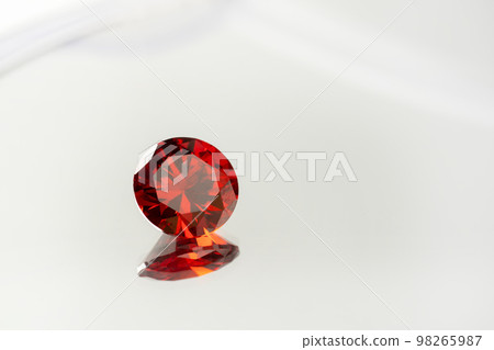 Red Ruby gemstone Round Cut on white background, close up shot 98265987