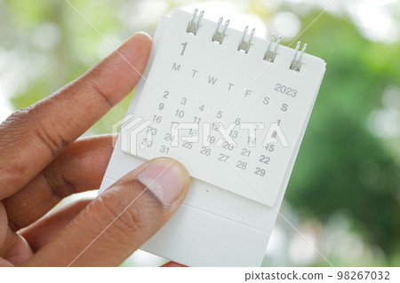 holding a 2023 year calendar outdoor holding a 2023 year calendar outdoor 98267032