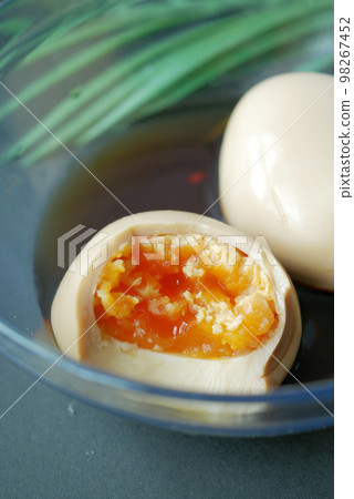 soy sauce marinated egg in a bowl . soy sauce marinated egg in a bowl . 98267452