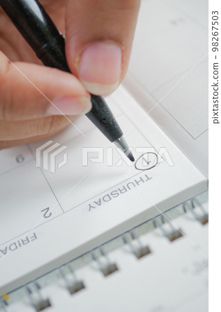 marking January 1 with a black color pen marking January 1 with a black color pen 98267503