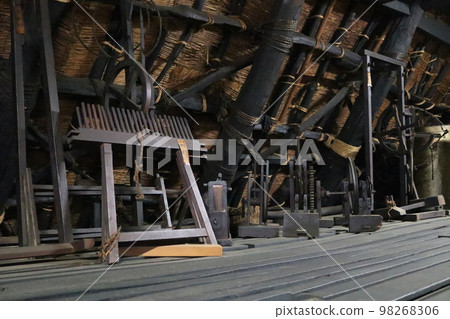 Attic in palm-stone building 98268306