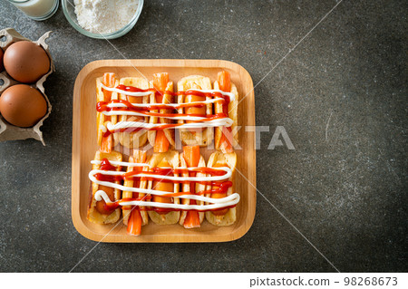 flat pancake roll with sausage and crab stick 98268673