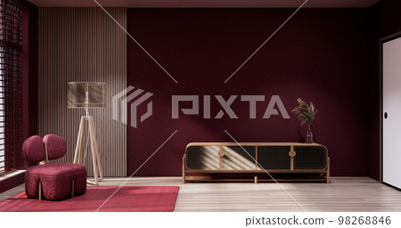 Cabinet in Viva magenta Living room with red wall and armchair japandi style. Cabinet in Viva magenta Living room with red wall and armchair japandi style. 98268846