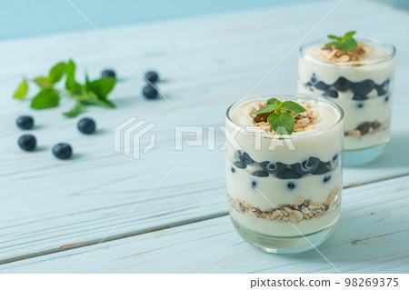 fresh blueberries and yogurt with granola fresh blueberries and yogurt with granola 98269375