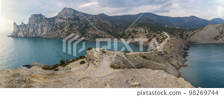 Panorama of the mountain peninsula and the sea. Cape Chicken and the Karaul-Oba Mountain in Novyi Svet. Crimea 98269744