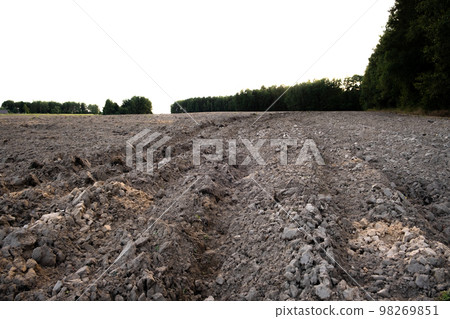 The arable field is ready for spring agricultural work. Plowed black soil 98269851