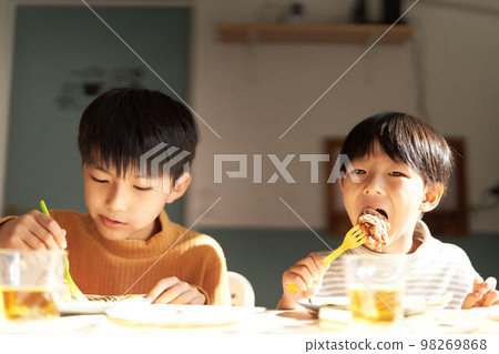 Two boys having a meal Lifestyle food education image 98269868