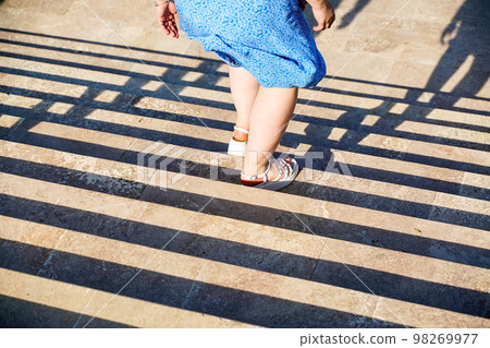 Staircase in the city, black and white pattern on the stairs on a sunny day. Staircase in the city, black and white pattern on the stairs on a sunny day. 98269977