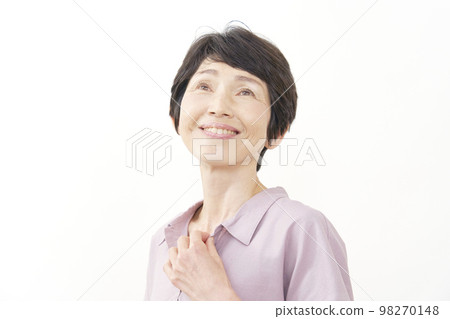 Portrait of a smiling middle-aged woman on a white background Portrait of a smiling middle-aged woman on a white background 98270148