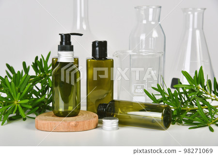Natural skincare beauty product, Cosmetic green bottle containers packaging with green nature Natural skincare beauty product, Cosmetic green bottle containers packaging with green nature 98271069
