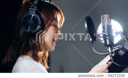 Female voice actor narrator reading the script Female voice actor narrator reading the script 98272393