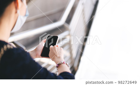 Woman hand holding a smart phone with blank screen. Woman hand holding a smart phone with blank screen. 98272649