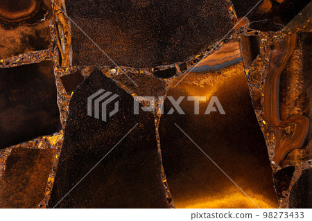 Tiger Eye Golden. Matt semiprecious texture as background. Mineral quartz beautiful golden-brown color with silky sheen. Material texture for unique interior, exterior design. Semi precious pattern. Tiger Eye Golden. Matt semiprecious texture as background. Mineral quartz beautiful golden-brown color with silky sheen. Material texture for unique interior, exterior design. Semi precious pattern. 98273433