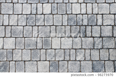 Paving slabs of gray color. Paving stones in walkway 98273970