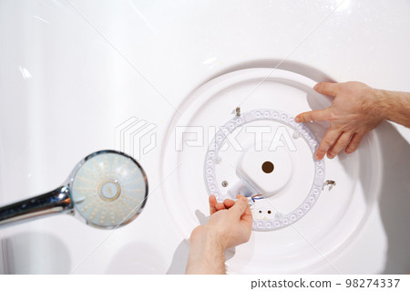 installation and connection of ring LED module. concept of modern lighting. 98274337