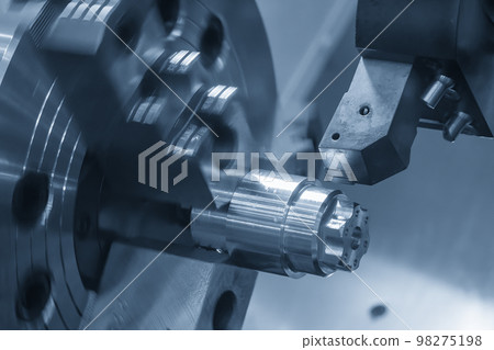 The  CNC lathe machine forming  cutting the metal shaft parts. 98275198