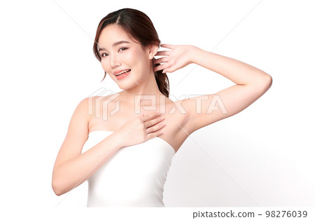 Beautiful Young Asian woman lifting hands up to show off clean and hygienic armpits or underarms on white background, Smooth armpit cleanliness and protection concept Beautiful Young Asian woman lifting hands up to show off clean and hygienic armpits or underarms on white background, Smooth armpit cleanliness and protection concept 98276039