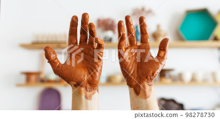 An expert potter, in his laboratory. The artisan creates works of art with his hands. Concept of 98278730