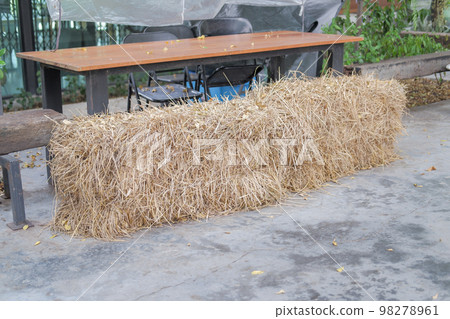 Large haystack of hay were prepared for the animals to eat. Large haystack of hay were prepared for the animals to eat. 98278961