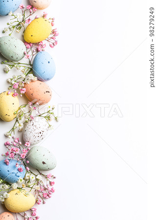 Easter composition of Easter quail eggs and flowers Easter composition of Easter quail eggs and flowers 98279249