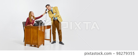 Woman, assistant sitting at the table and giving phone to her boss, businessman. Partnership, professional talks. Banner, flyer 98279355