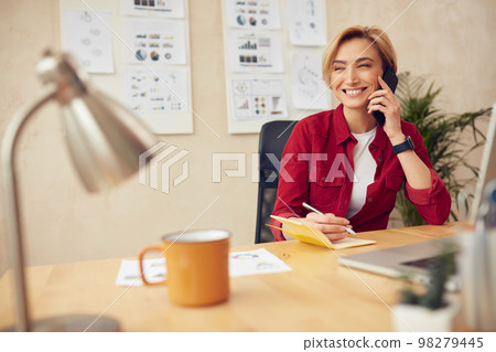 Smiling Businesswoman Calling Smartphone. Positive Blonde Woman Talking On Phone Smiling Businesswoman Calling Smartphone. Positive Blonde Woman Talking On Phone 98279445