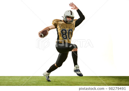 Man, professional american football player in motion, training over white studio background. Motivated sportsman. Concept of sport, competition 98279491