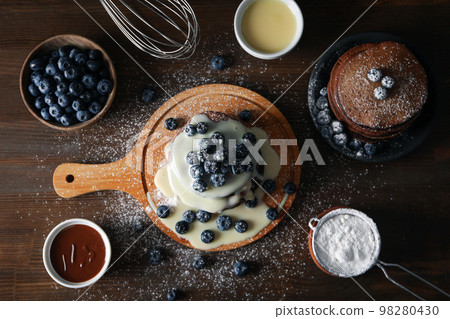 Concept of sweet food, chocolate pancakes, top view Concept of sweet food, chocolate pancakes, top view 98280430