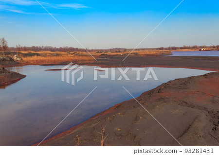 Technical settler of industrial water of mining industry in Kryvyi Rih, Ukraine. Red water polluted with iron ore waste 98281431
