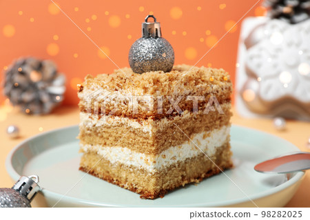 Concept of tasty sweets, delicious honey cake Concept of tasty sweets, delicious honey cake 98282025