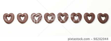 Concept of tasty bakery, gingerbread cookies in chocolate, top view Concept of tasty bakery, gingerbread cookies in chocolate, top view 98282044