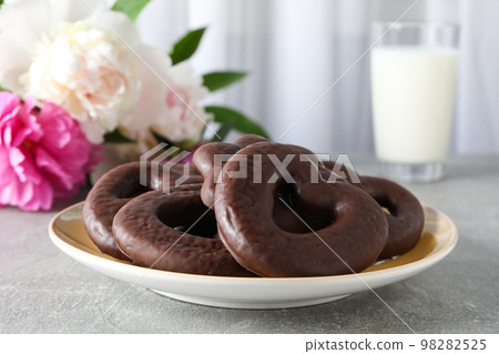 Concept of tasty bakery, gingerbread cookies in chocolate, close up Concept of tasty bakery, gingerbread cookies in chocolate, close up 98282525