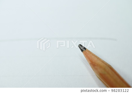 wooden pencil on white paper wooden pencil on white paper 98283122