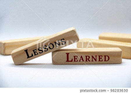 Lessons learned text on wooden blocks on white cover background. Lessons learned concept. Lessons learned text on wooden blocks on white cover background. Lessons learned concept. 98283630