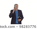 man in a suit with a calendar talking on the mobile on a white background 98283776